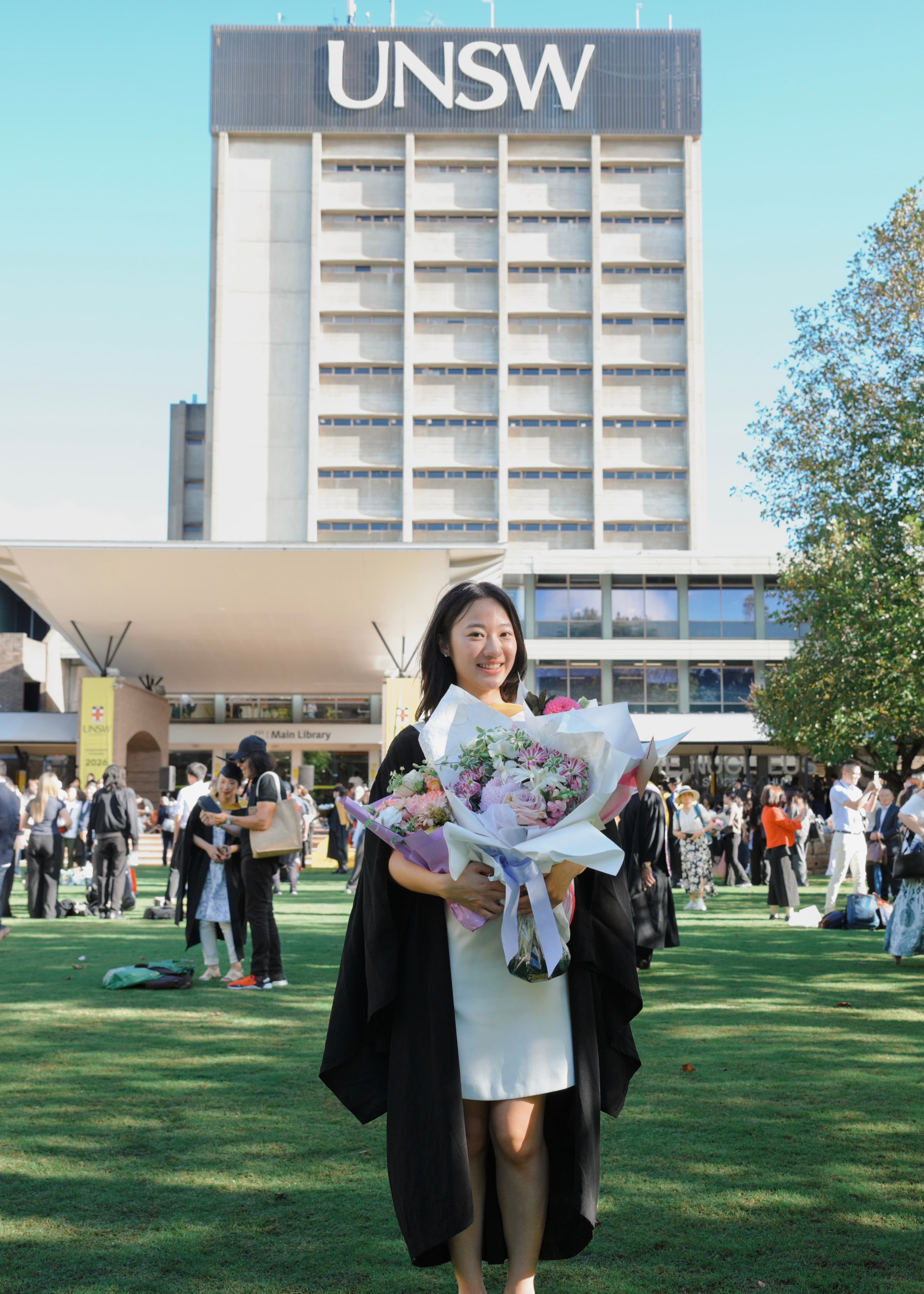 Graduate portrait on campus steps